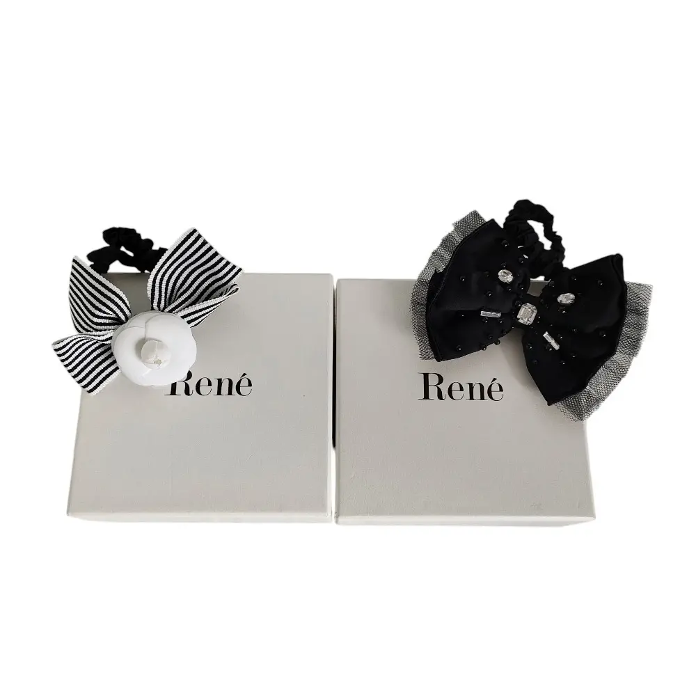 Rene ルネ カメリア リボン ビジュー ヘアゴム ヘアアクセサリー 箱付き 2点セット ブラック×ホワイトの買取実績【2025年7月買取】